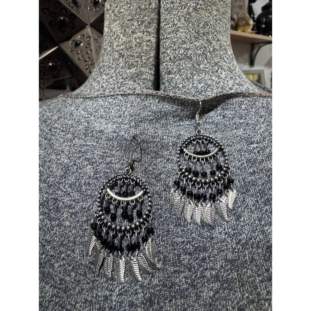 Silvertone and black bead dangle feather earrings